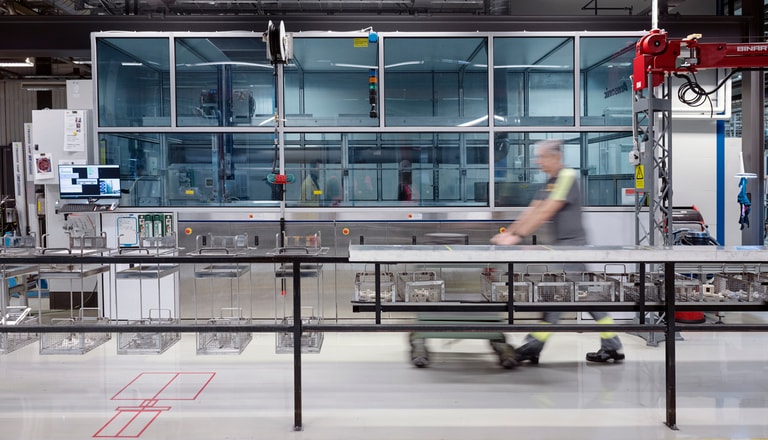 A man walking in a modern production environment