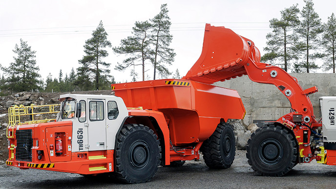 A Sandvik truck and loader in a quarry