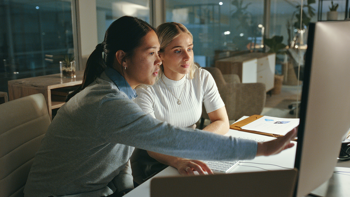 Two woman looking at a screen